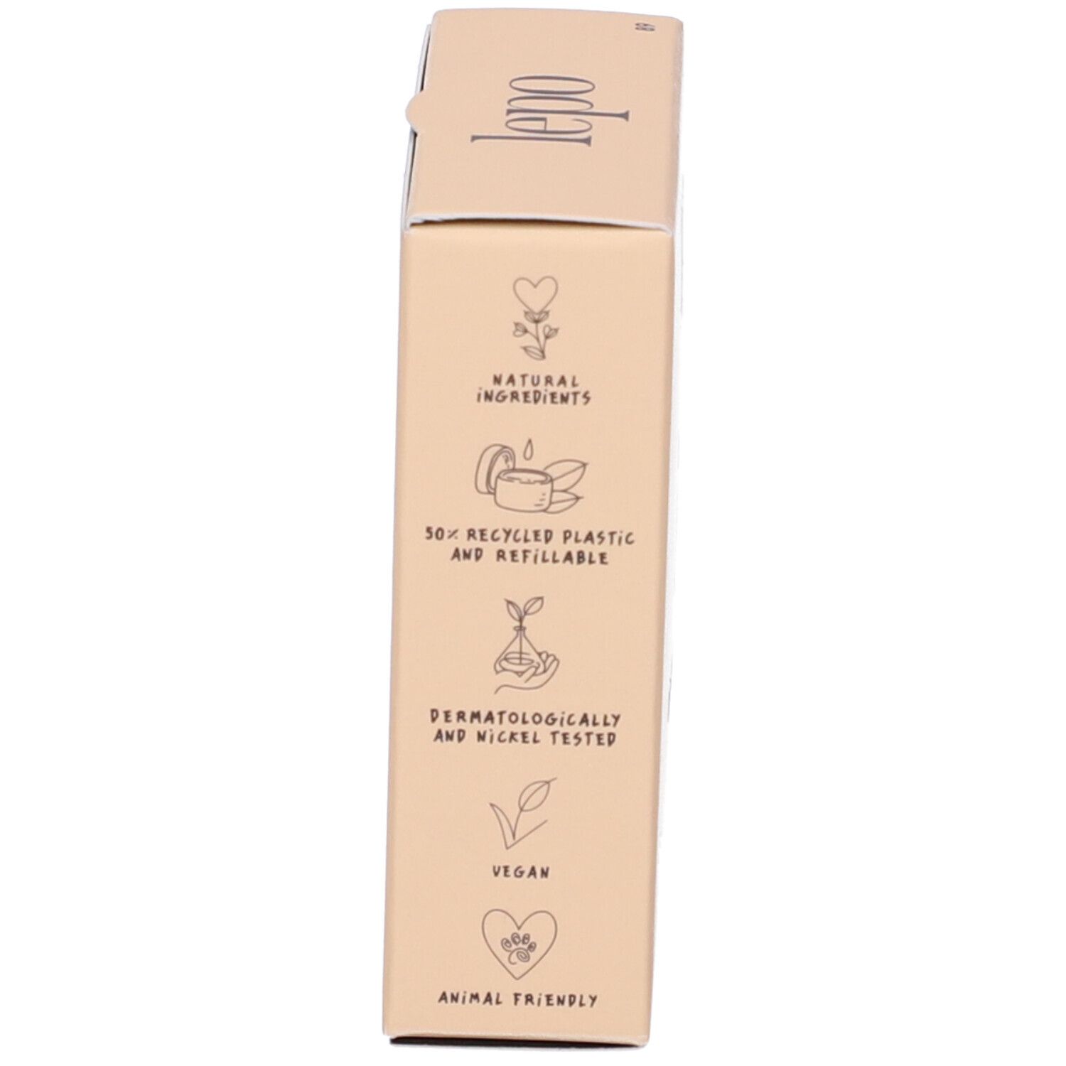 Lato della confezione del prodotto. Loghi: naturale, 50% riciclato, dermatologicamente testato, vegano, amico degli animali. Confezione beige.