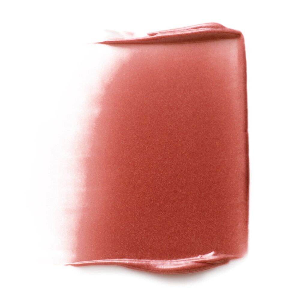 Tinta rosa per labbra e guance su sfondo bianco. Trama visibile.