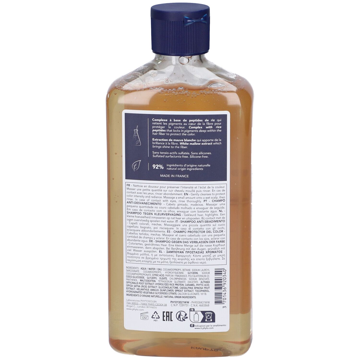 Retro del flacone di shampoo. Testo con ingredienti e informazioni del produttore. Etichette blu e bianche.