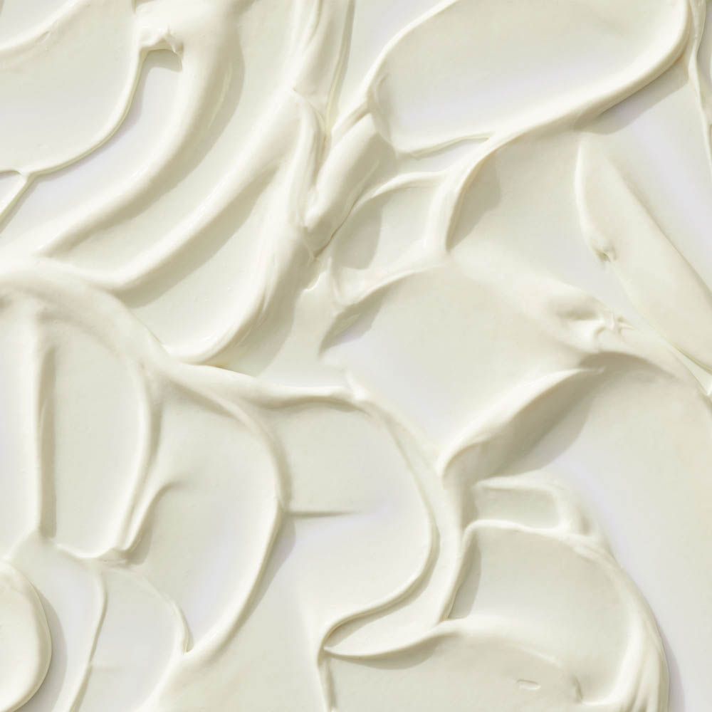Texture di crema bianca con motivo ondulato.