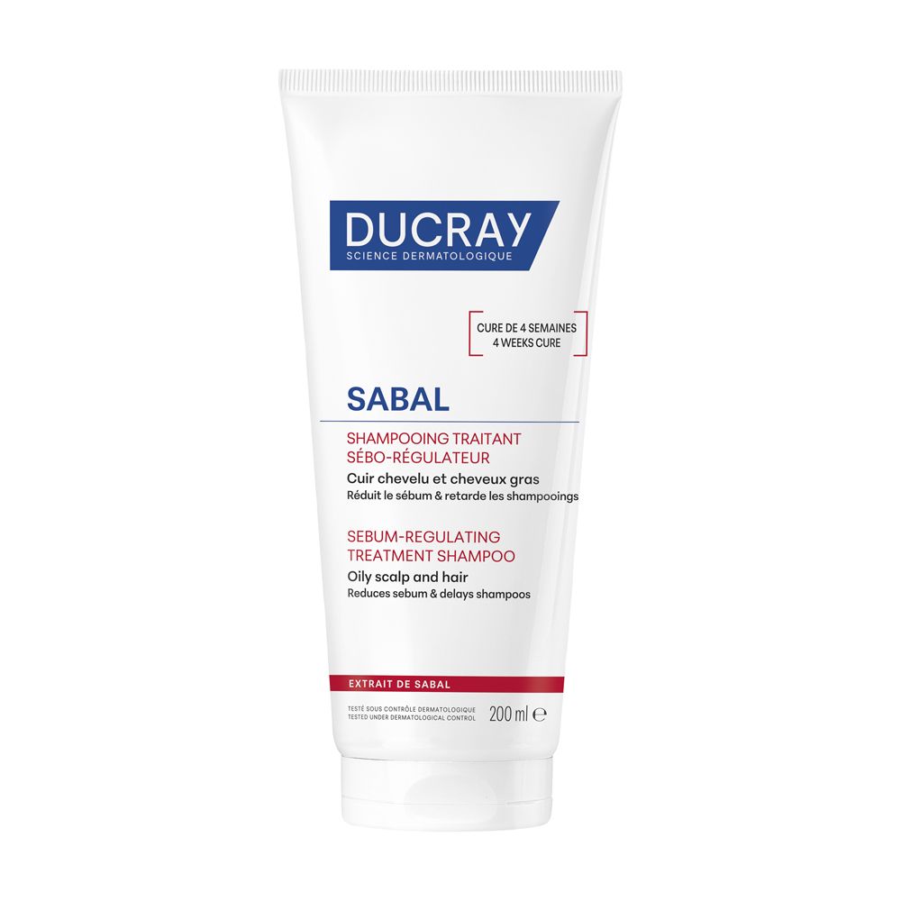 Tubo bianco con etichetta blu e rossa. Scritta: Ducray Sabal Shampoo. Testo in francese e inglese. 200ml.