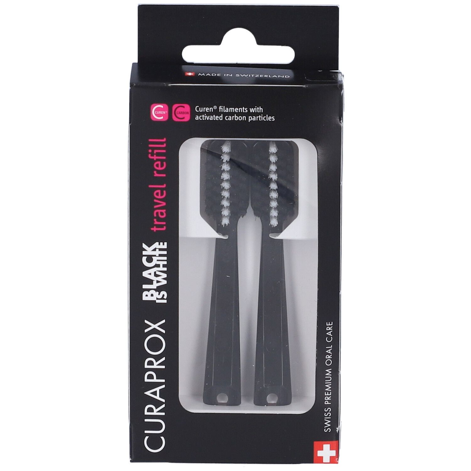 Testine di ricambio nere per spazzolino in confezione. Marchio Curaprox, scritta Black is White. Due testine visibili.