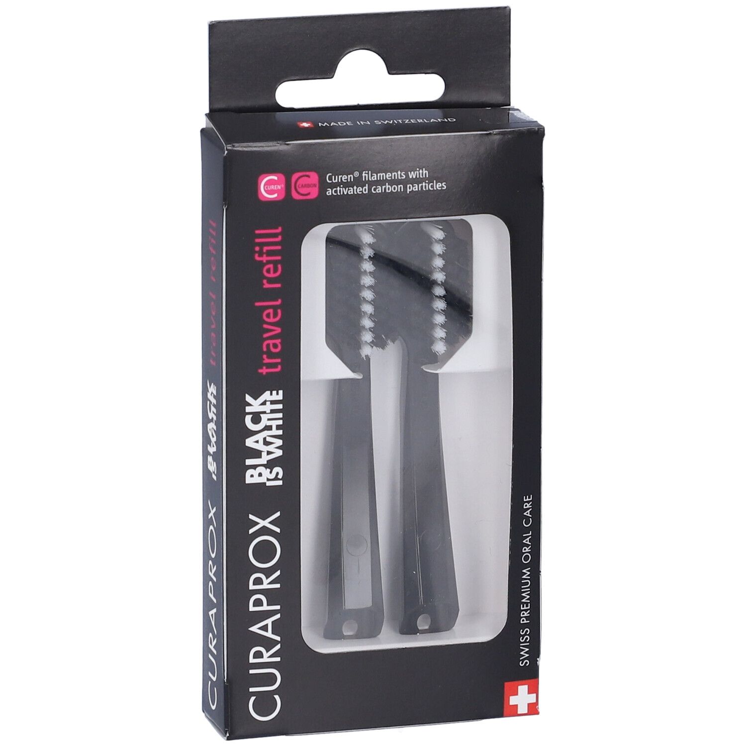Testine di ricambio nere per spazzolino in confezione. Marchio Curaprox, scritta Black is White. Due testine visibili.