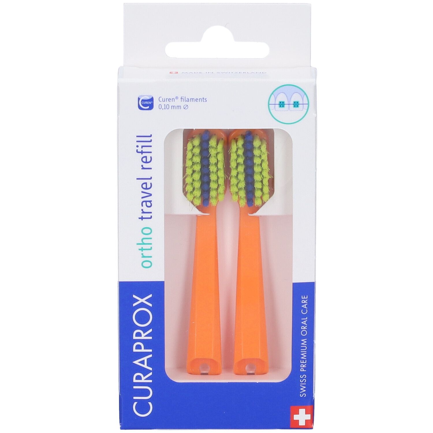 Due testine arancioni con setole verdi e blu in confezione. Marchio: CURAPROX.