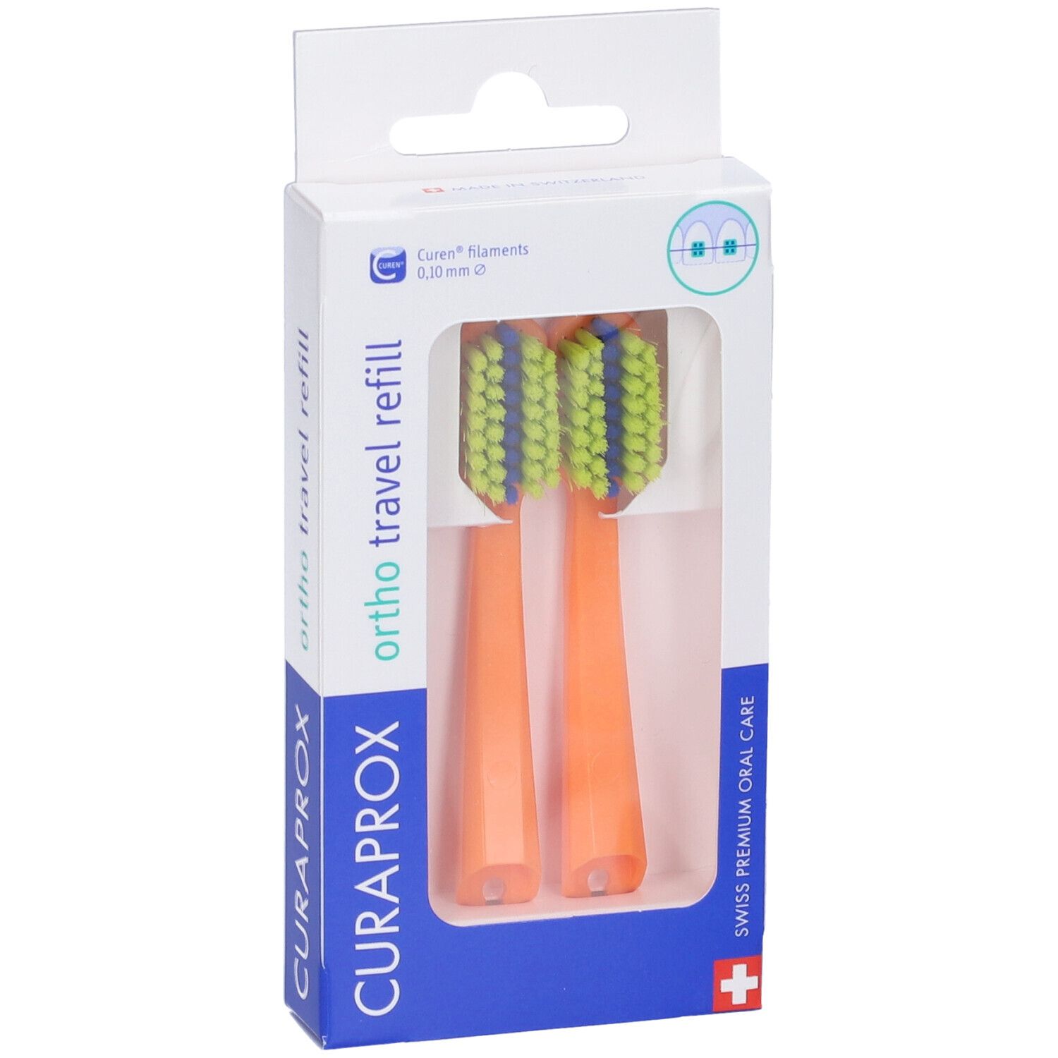 Due testine arancioni con setole verdi e blu in confezione. Marchio: CURAPROX.