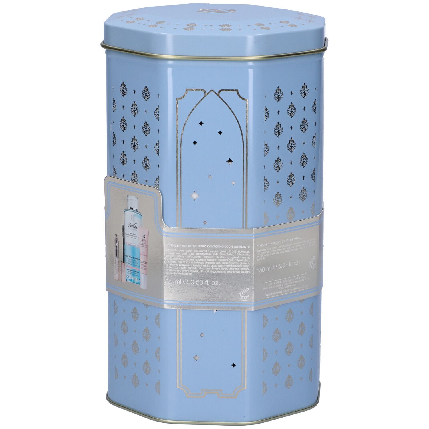 Scatola esagonale azzurra con decorazioni argentate. Contiene prodotti. Adesivo con immagine e testo del prodotto.