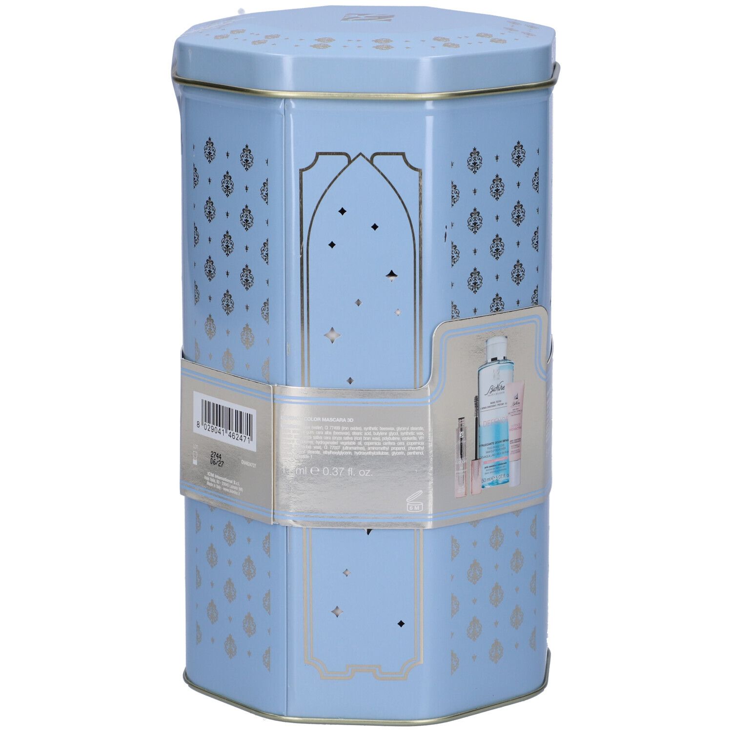 Scatola esagonale azzurra con decorazioni argentate. Contiene prodotti. Adesivo con immagine e testo del prodotto.