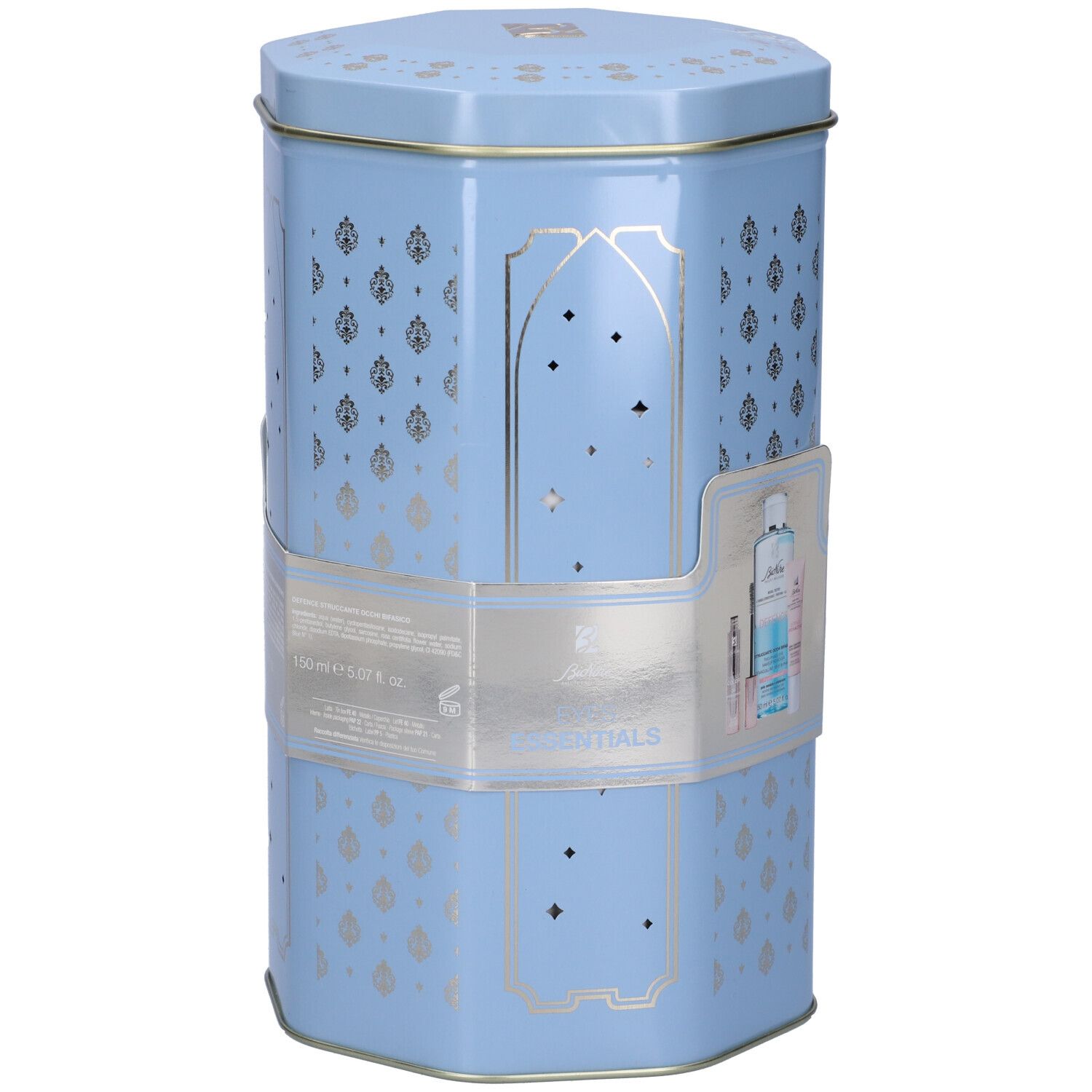 Scatola esagonale azzurra con decorazioni argentate. Contiene prodotti. Adesivo con immagine e testo del prodotto.