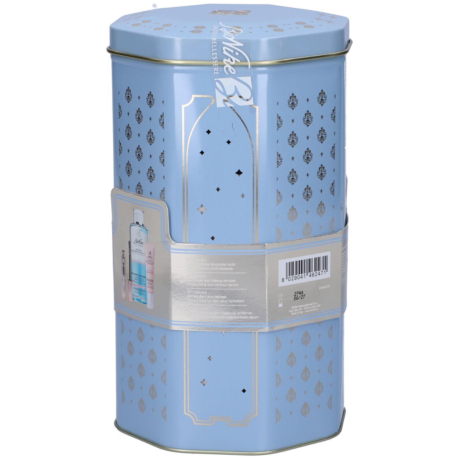 Scatola esagonale azzurra con decorazioni argentate. Contiene prodotti. Adesivo con immagine e testo del prodotto.