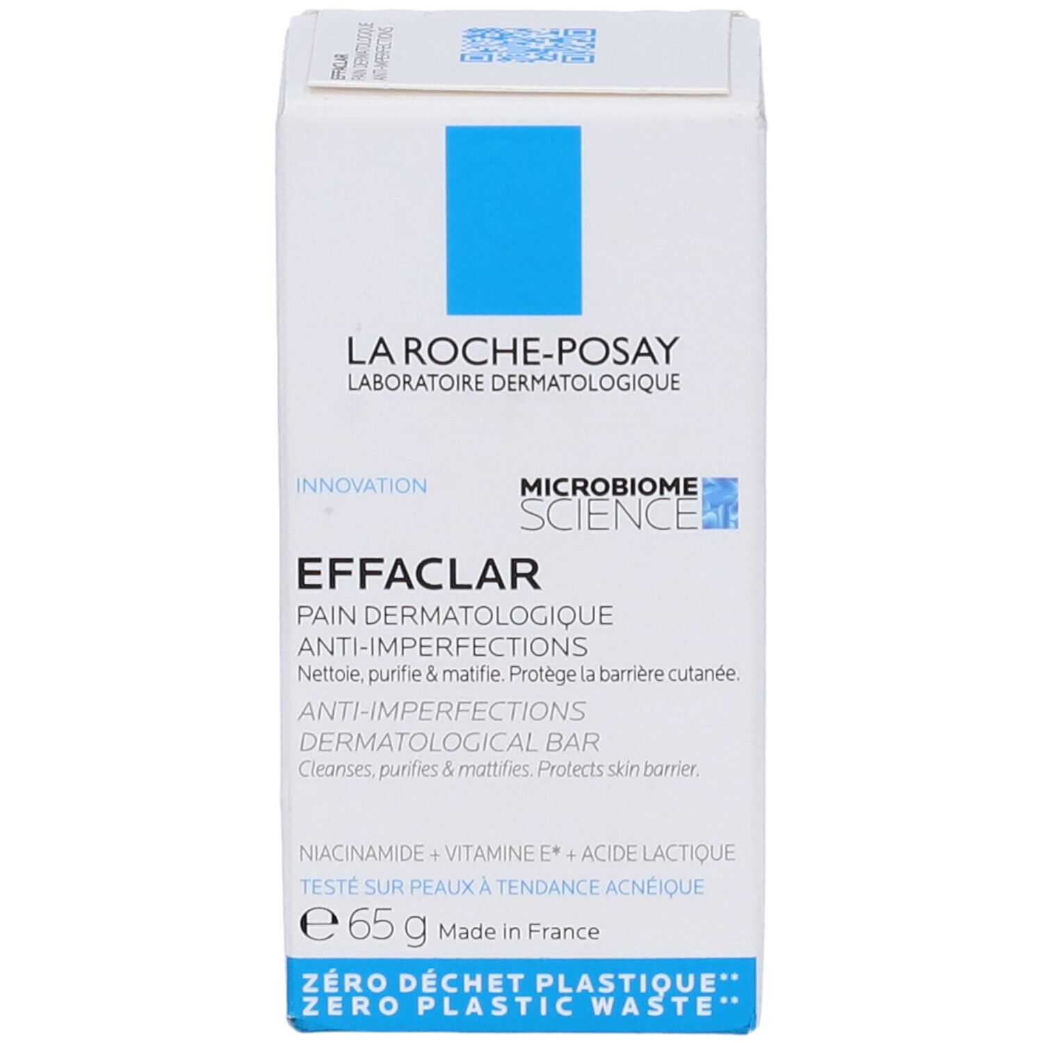 Scatola bianca con quadrato blu. Scritto: La Roche-Posay, Effaclar, Anti-imperfezioni, bar dermatologico. 65g.