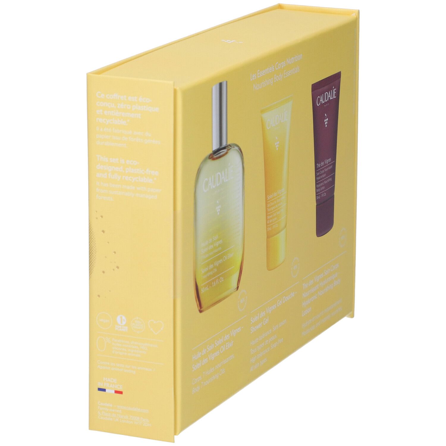 Confezione regalo gialla con tre prodotti. Logo Caudalie e nomi dei prodotti parzialmente visibili. Vista laterale.