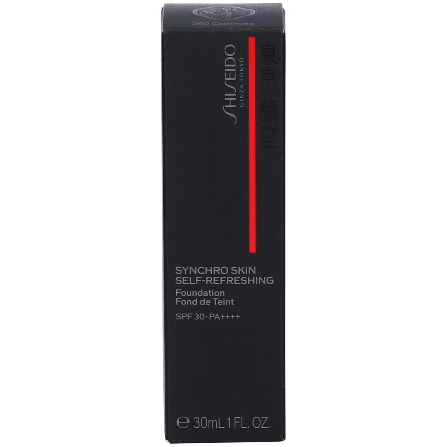 Scatola nera di fondotinta Shiseido. Nome del prodotto, marchio e fattore SPF. Striscia rossa.