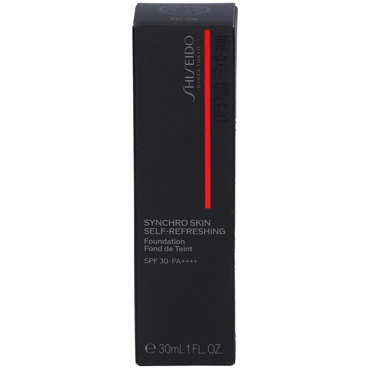 Scatola nera Shiseido per fondotinta con striscia verticale rossa. Contiene 30ml, SPF 30.