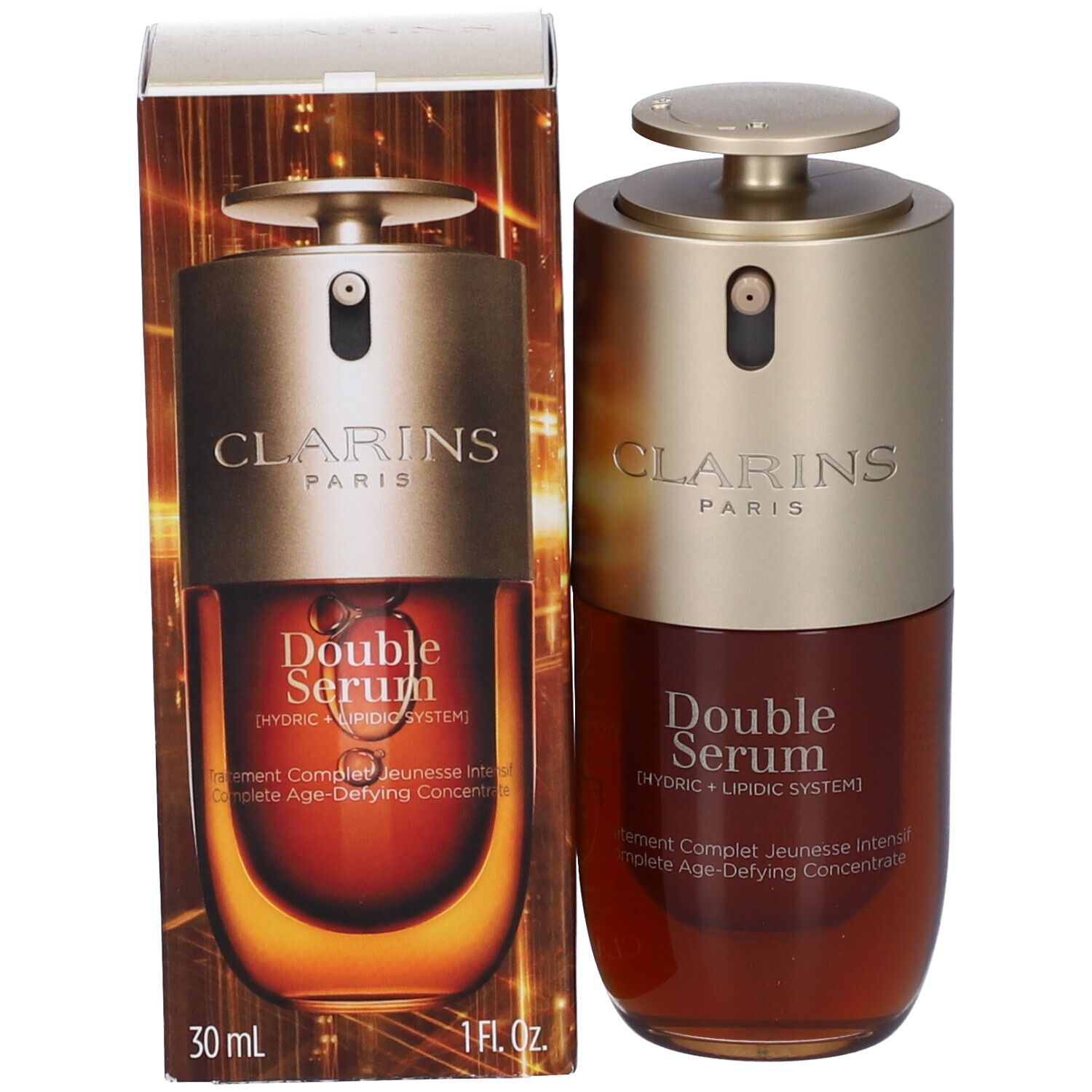 Flacone Clarins Double Serum accanto alla sua confezione con accenti dorati e marroni.
