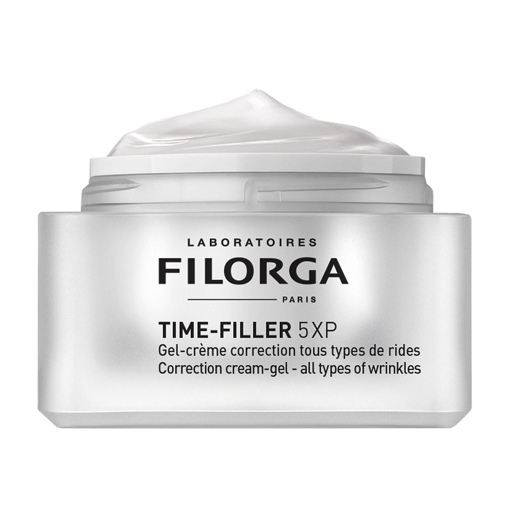 Vasetto di crema-gel. Vasetto bianco con coperchio argentato. Crema sul coperchio. Scritta nera: FILORGA, TIME-FILLER 5XP.