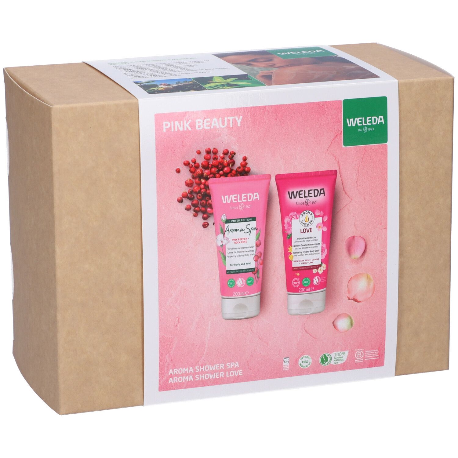 Confezione regalo con due gel doccia rosa. Imballaggio con immagini del prodotto e logo Weleda. Imballaggio in cartone.