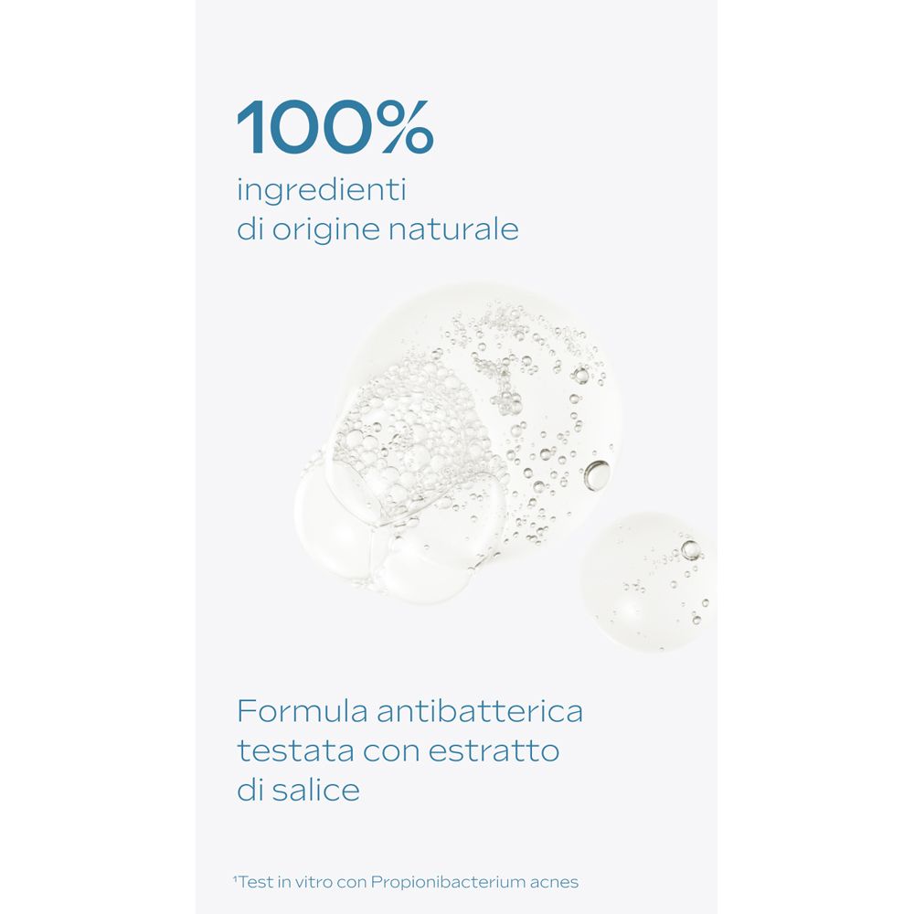 Primo piano di gocce di liquido. Testo: 100% ingredienti di origine naturale. Formula antibatterica testata con estratto di salice.