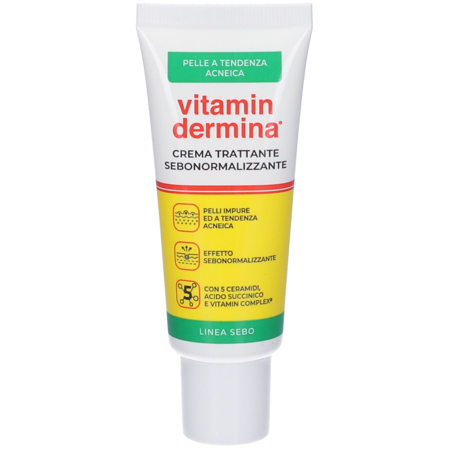 Tubo di crema Vitamin Dermina, bianco con accenti verdi e gialli. Testo: CREMA TRATTANTE SEBONORMALIZZANTE.