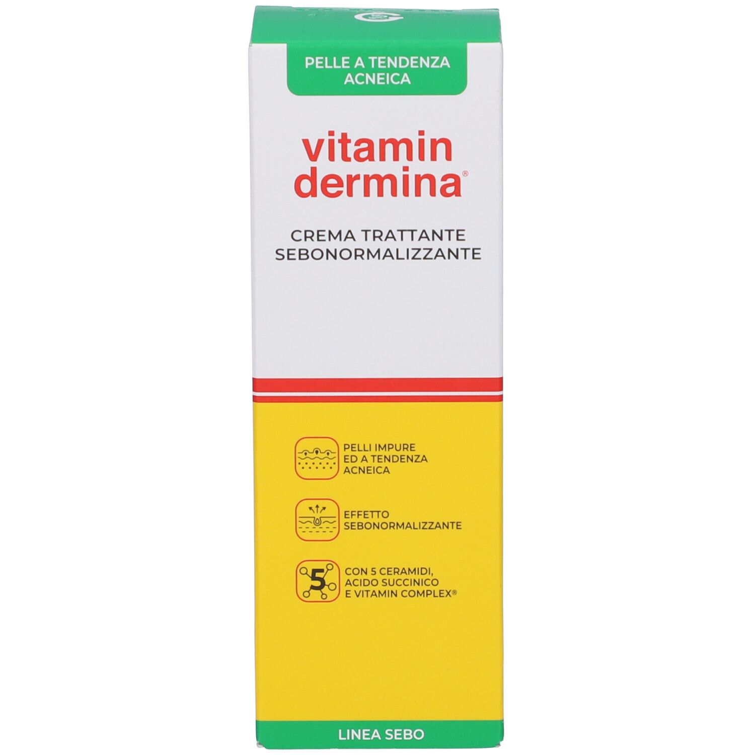 Scatola di crema Vitamin Dermina, bianca con accenti verdi e gialli. Testo: CREMA TRATTANTE SEBONORMALIZZANTE.