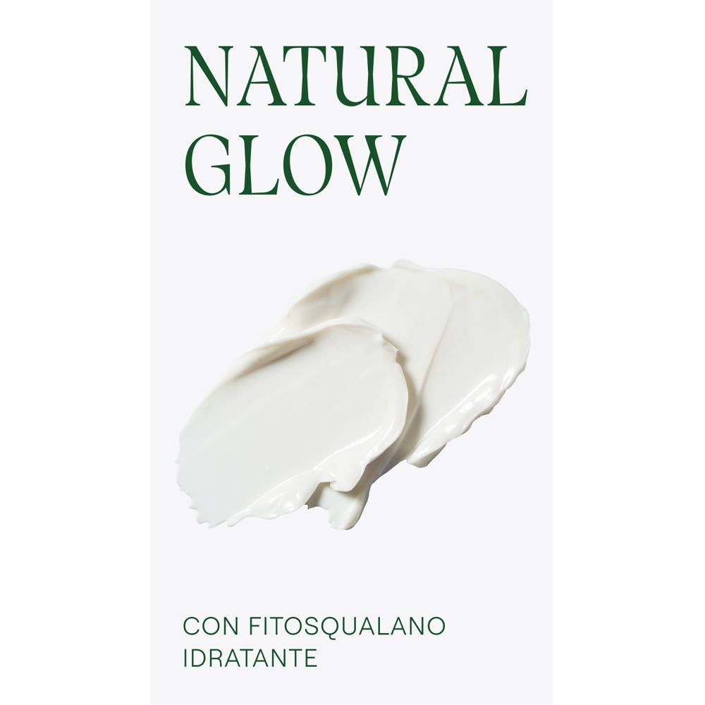 Sfondo bianco con strisce di crema. Scritta: NATURAL GLOW, CON FITOSQUALANO IDRATANTE.