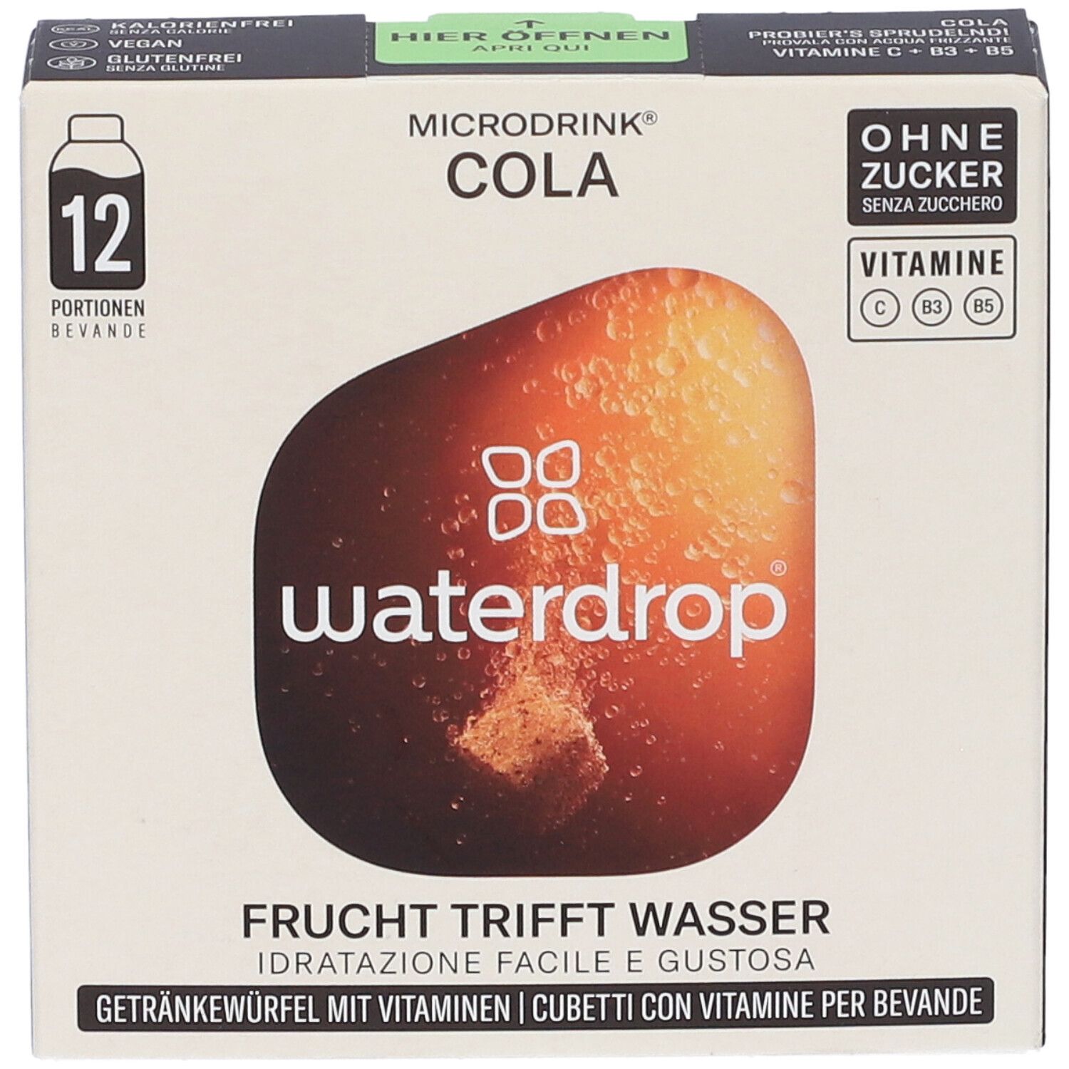 Vista frontale della confezione WATERDROP MICRODRINK COLA. Contiene 12 porzioni. Testo: Senza zucchero, vitamine C, B3, B5. Frutta incontra l'acqua.