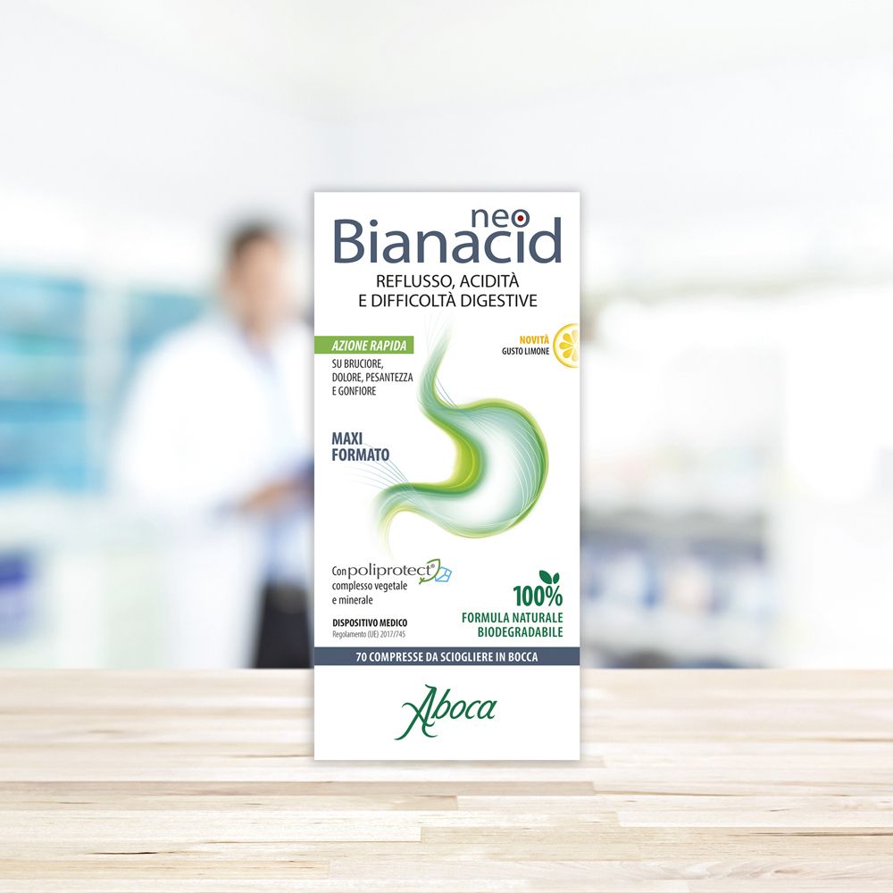 Confezione del prodotto "neo Bianacid". Testo: Reflusso, acidità, difficoltà digestive. Sfondo: persona sfocata.