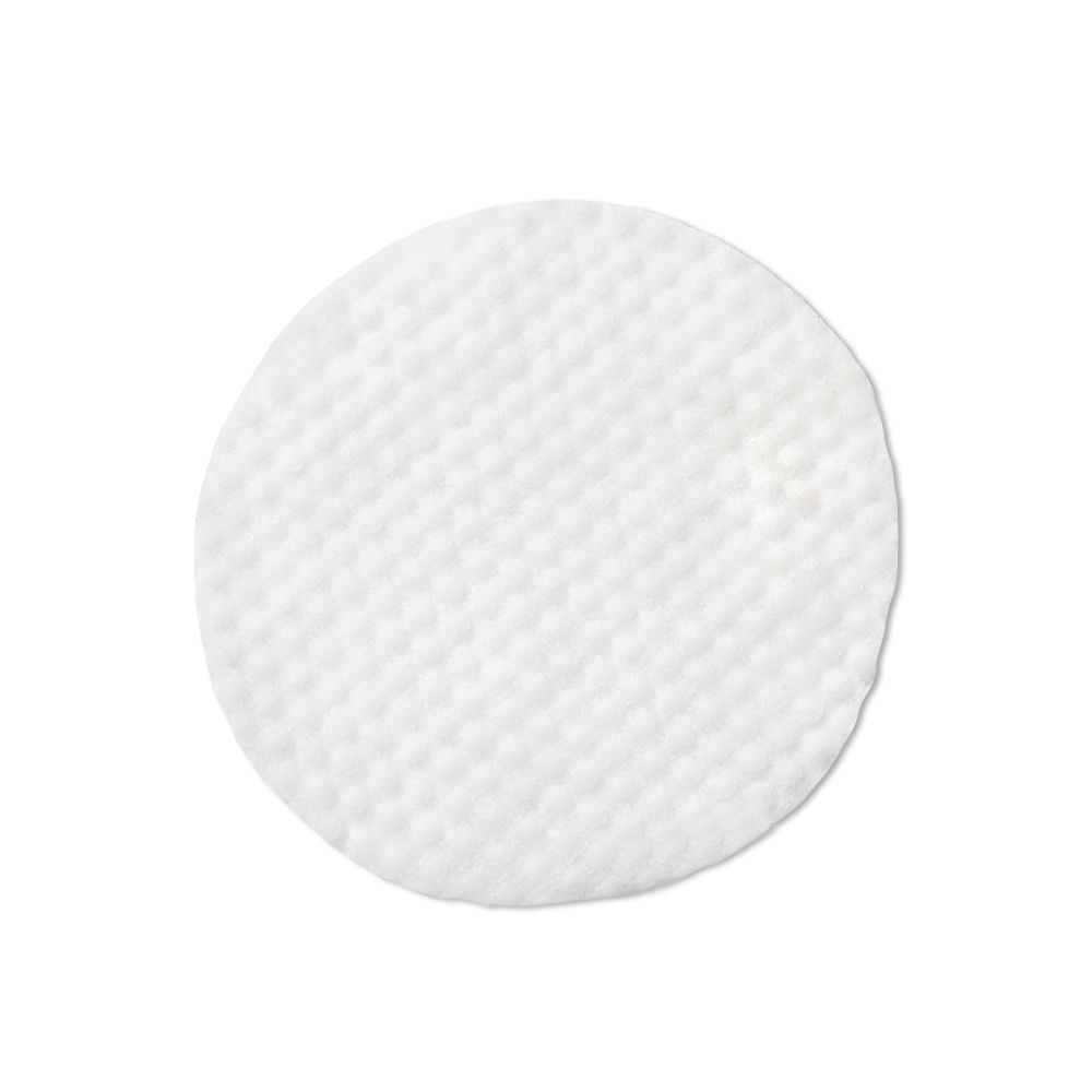 Pad rotondo bianco, superficie a rilievo. Prodotto singolo, isolato.