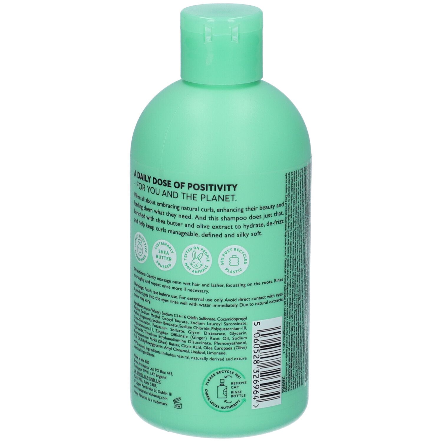 Retro di un flacone di shampoo verde chiaro. Sezioni di testo, loghi e simbolo di riciclaggio.