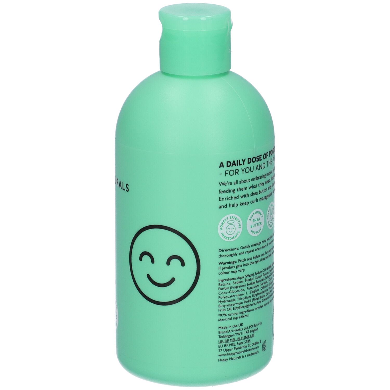 Retro di un flacone di shampoo verde chiaro. Testo, loghi e una faccia sorridente.