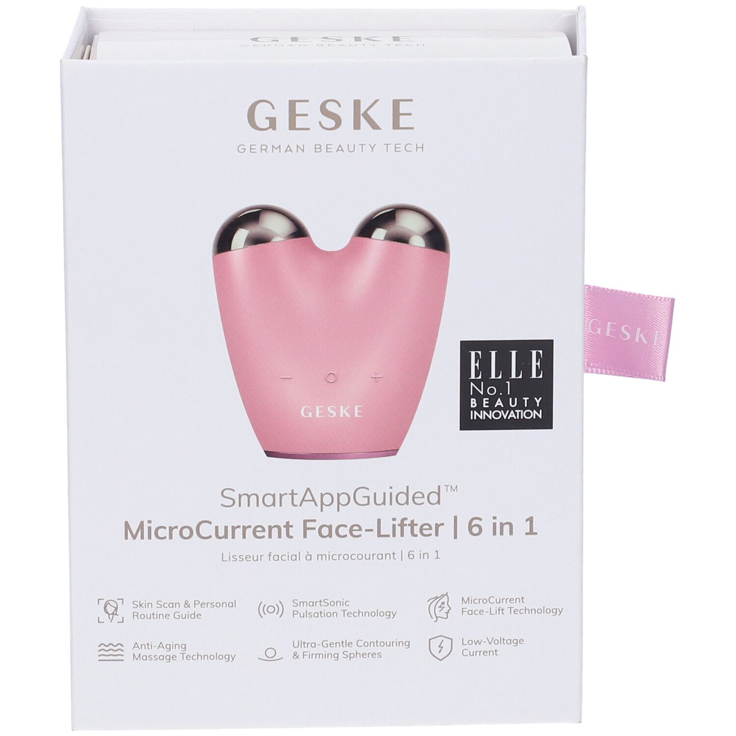 MicroCurrent Face-Lifter rosa nella confezione. Scritte: GESKE, SmartAppGuided, ELLE, premi. Fiocco rosa.