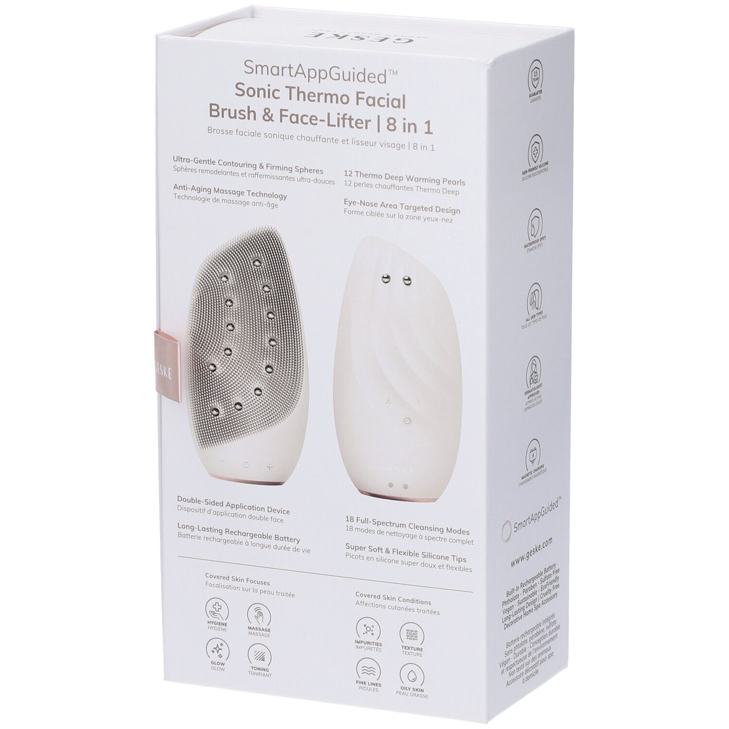 Confezione bianca con immagine del prodotto. Testo: SmartAppGuided Sonic Thermo Facial Brush & Face-Lifter 8 in 1. Icone e caratteristiche del prodotto.