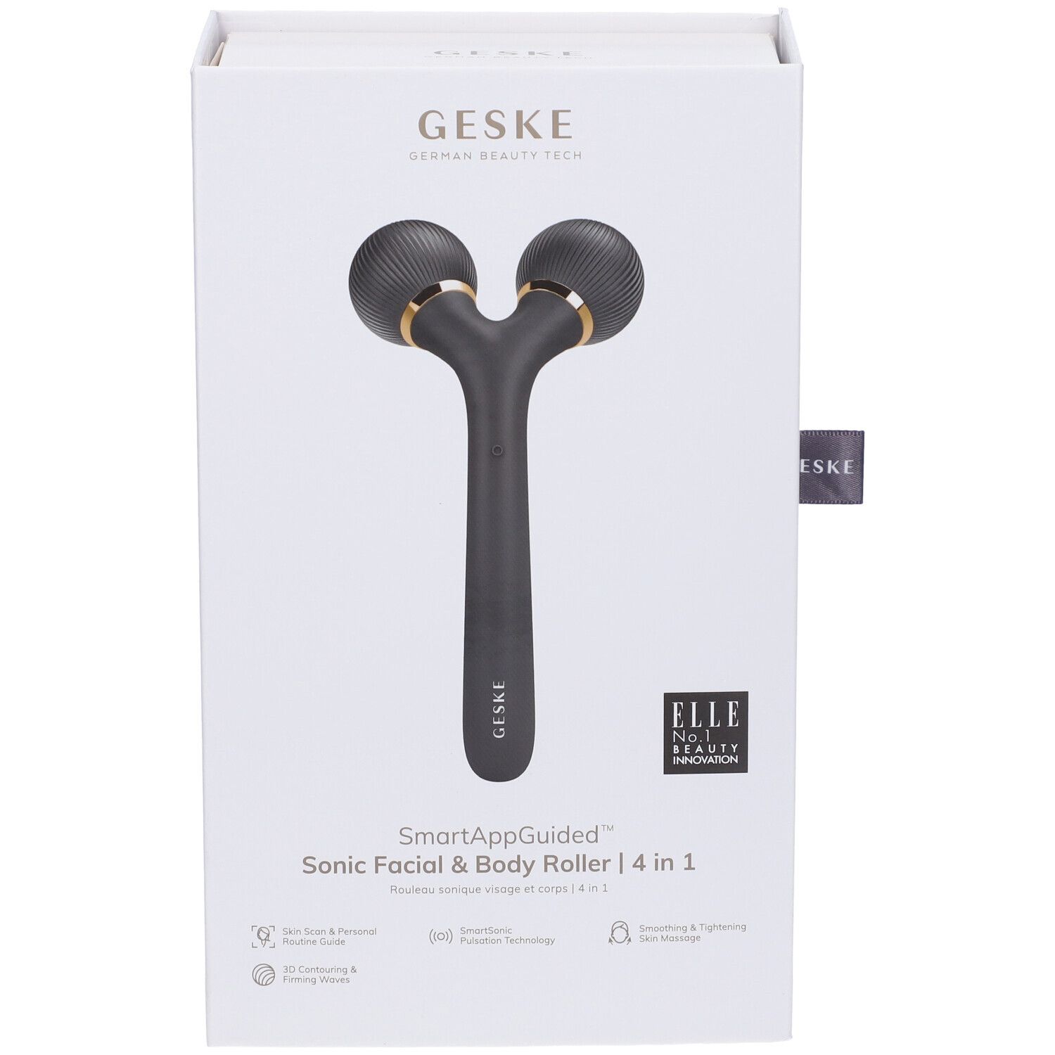 Confezione, fronte. Rullo nero con due testine rotonde e dettagli dorati. Testo: SmartAppGuided, Sonic Facial & Body Roller 4 in 1. Logo ELLE.