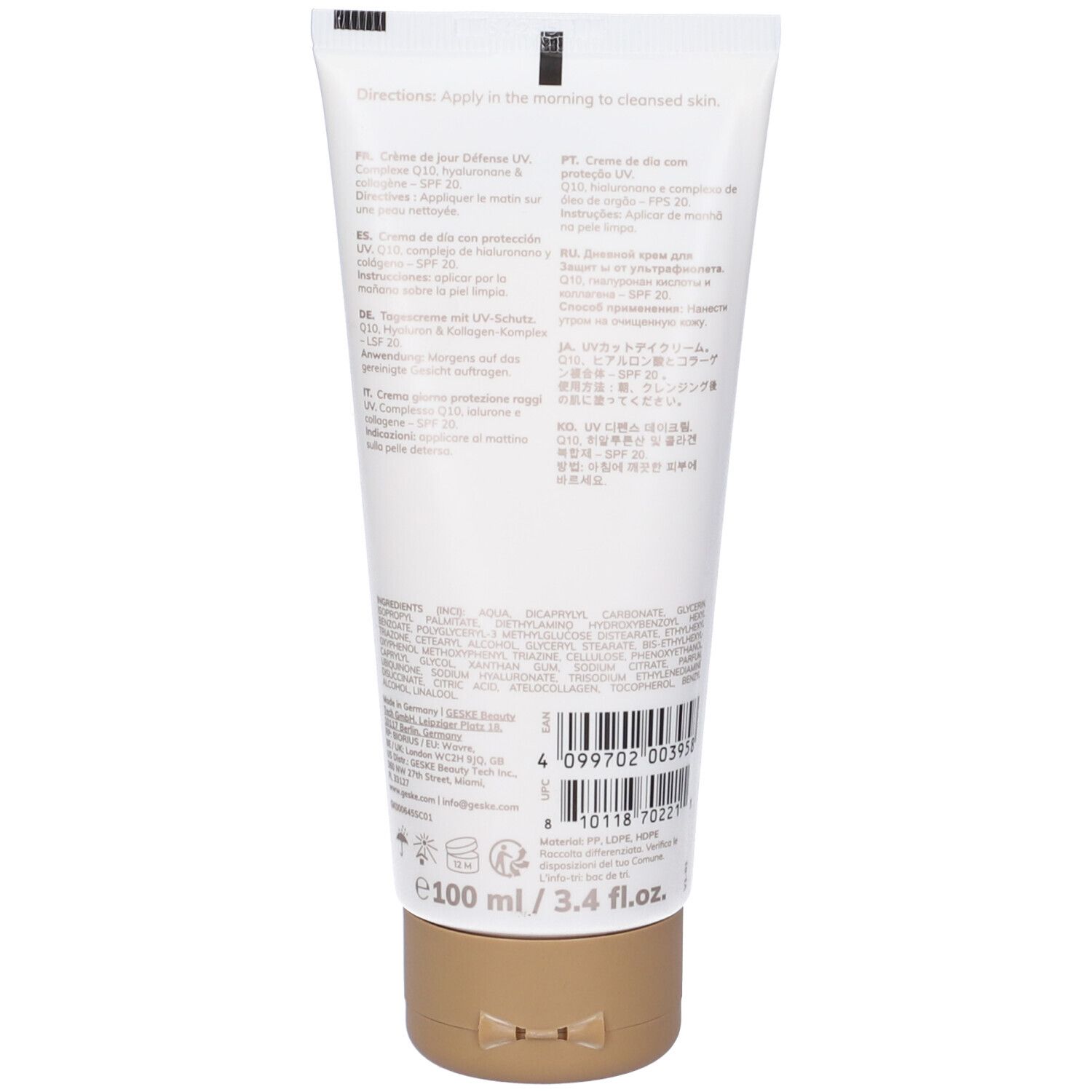 Retro del tubo. Testo multilingue. Codice a barre e indicazione del volume: 100 ml / 3.4 fl.oz. Tappo dorato.