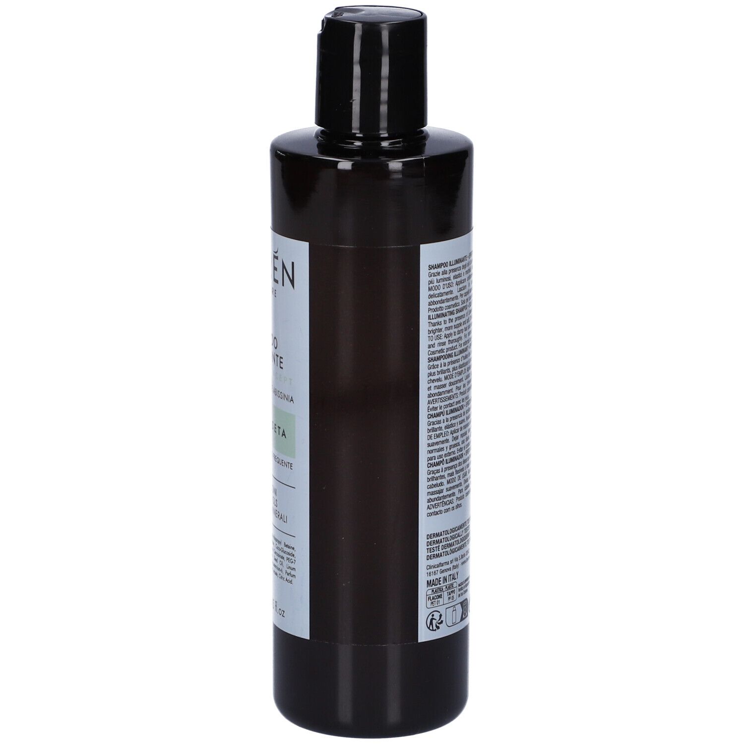 Flacone di shampoo scuro, vista laterale. Etichetta con testo. Tappo nero.