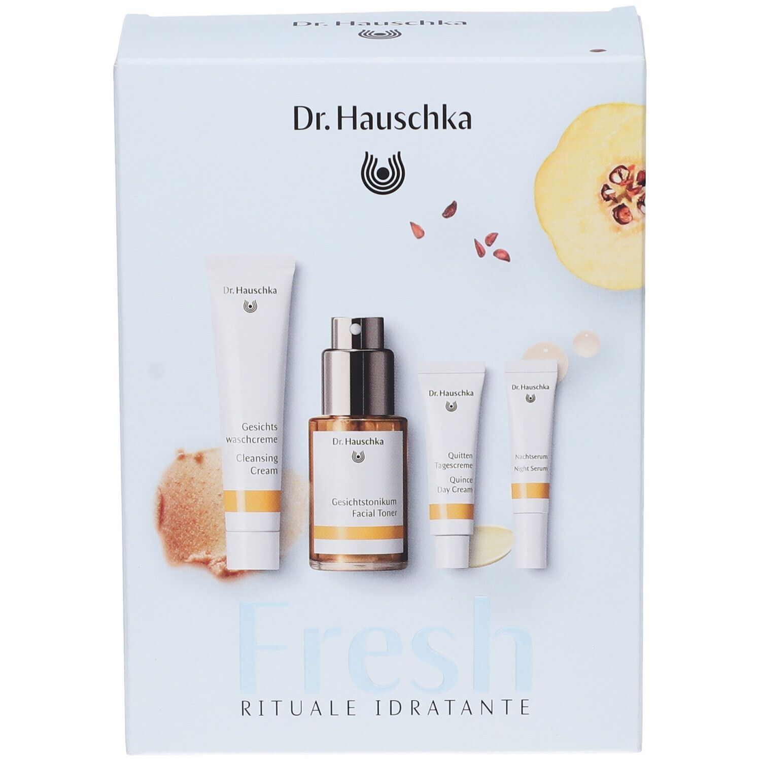 Scatola con quattro prodotti Dr. Hauschka. Logo, nomi dei prodotti, mela cotogna, scritta 'Fresh Rituale Idratante'.