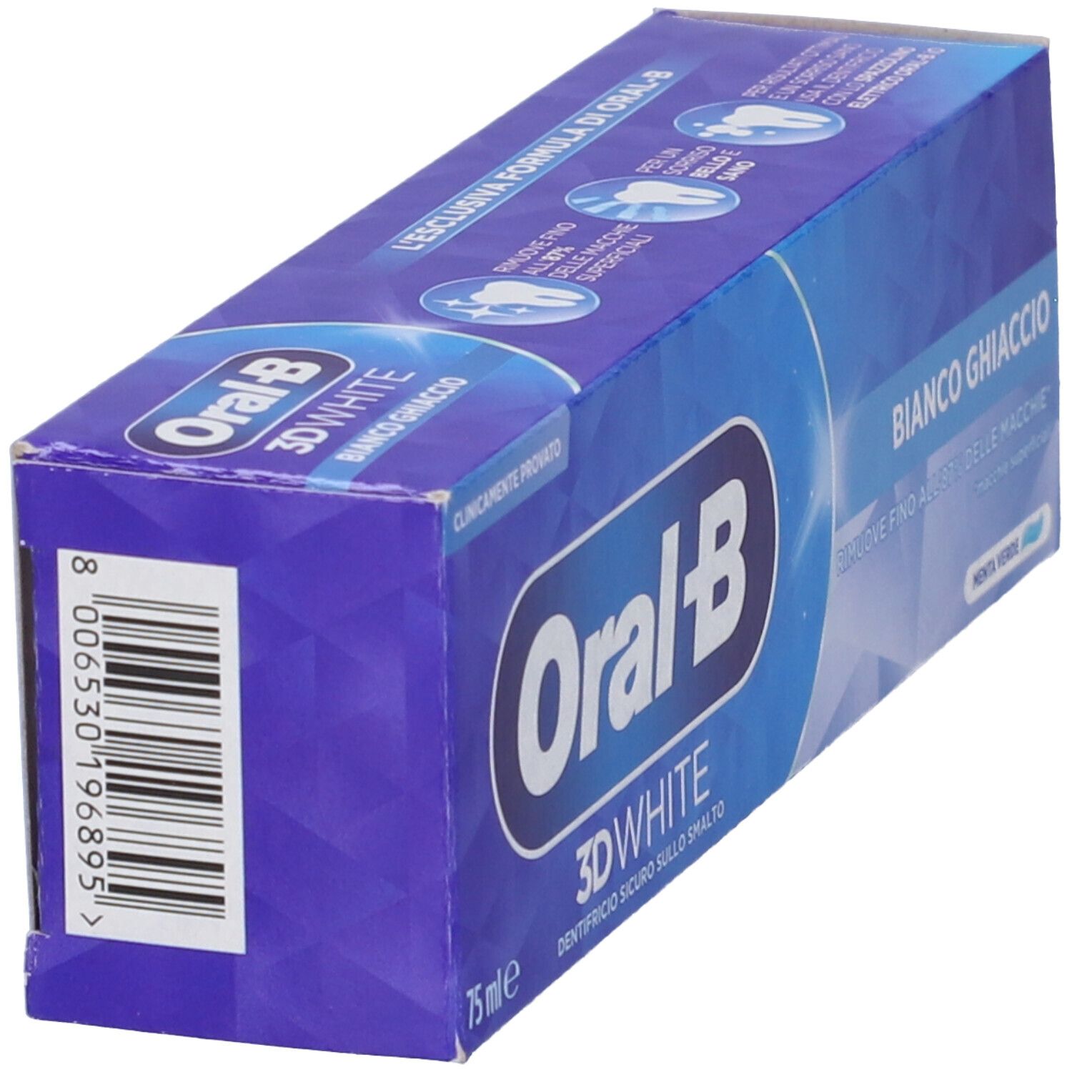 Vista laterale della confezione di dentifricio. Scatola blu e bianca Oral-B. Codice a barre visibile.