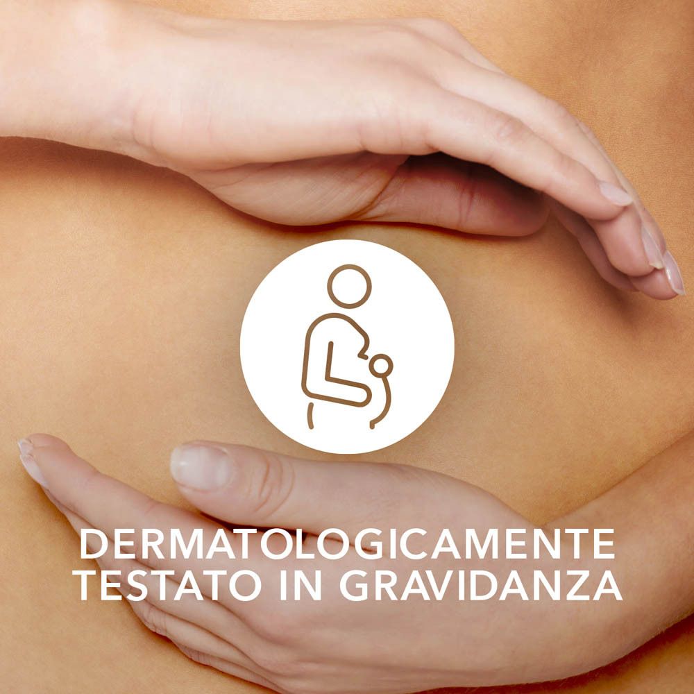 Mani che circondano una pancia con un simbolo di gravidanza e la scritta "Dermatologicamente testato in gravidanza".