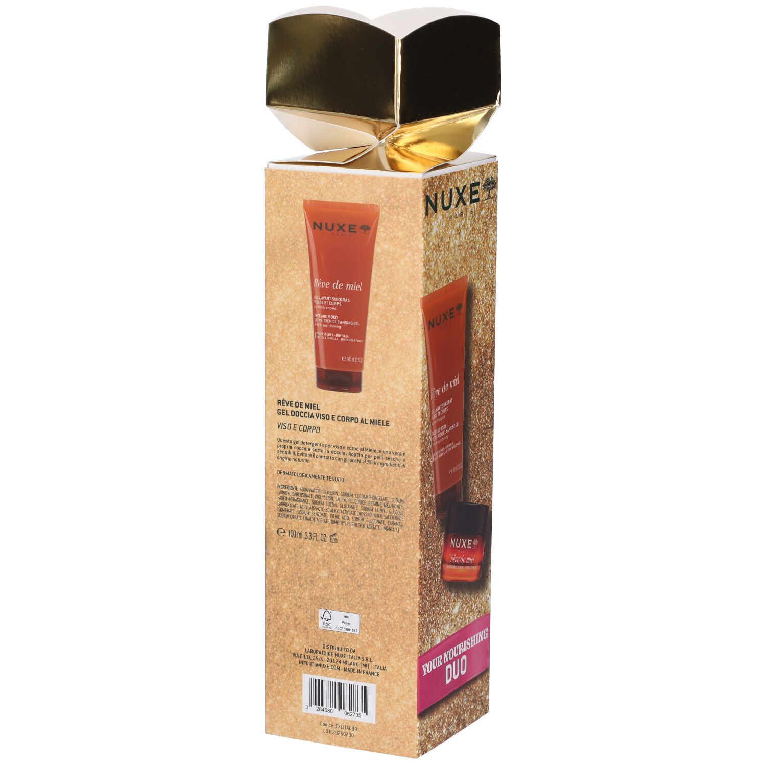 Confezione regalo con due tubi di prodotti per la cura del corpo, decorata con nastro dorato.
