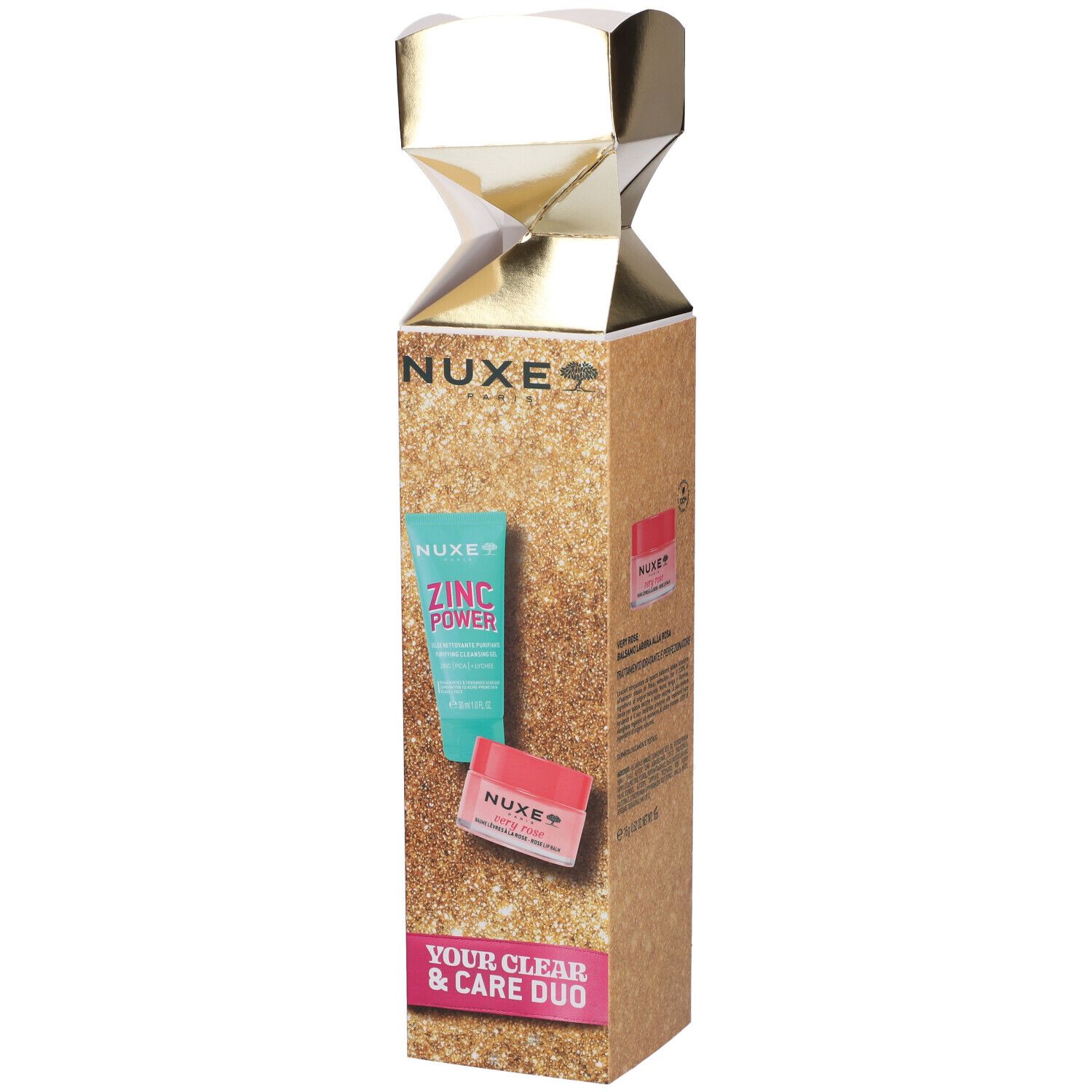 Confezione regalo Nuxe con un tubetto e un vasetto in confezione dorata e scintillante.