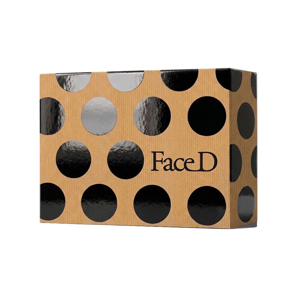 Confezione Kit Bellezza FaceD con motivo a pois.