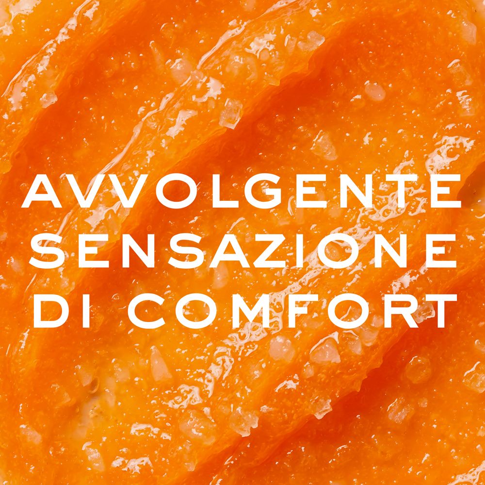 Primo piano di scrub corpo al miele con cristalli di zucchero visibili.