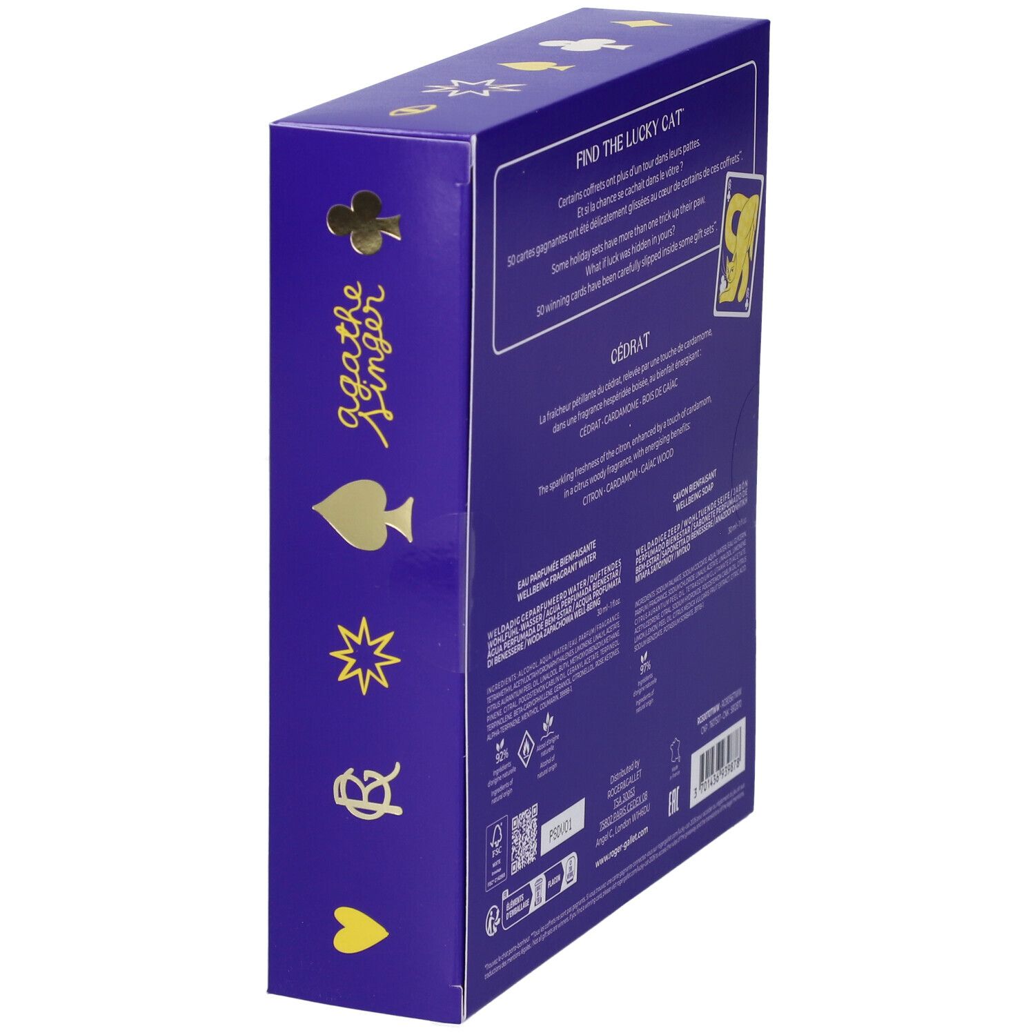 Scatola regalo viola con simboli di carte da gioco, scritta 'Agathe Singer' e testo 'Find the Lucky Cat'. Contiene Eau Parfumee e Savon Bienfaisant.