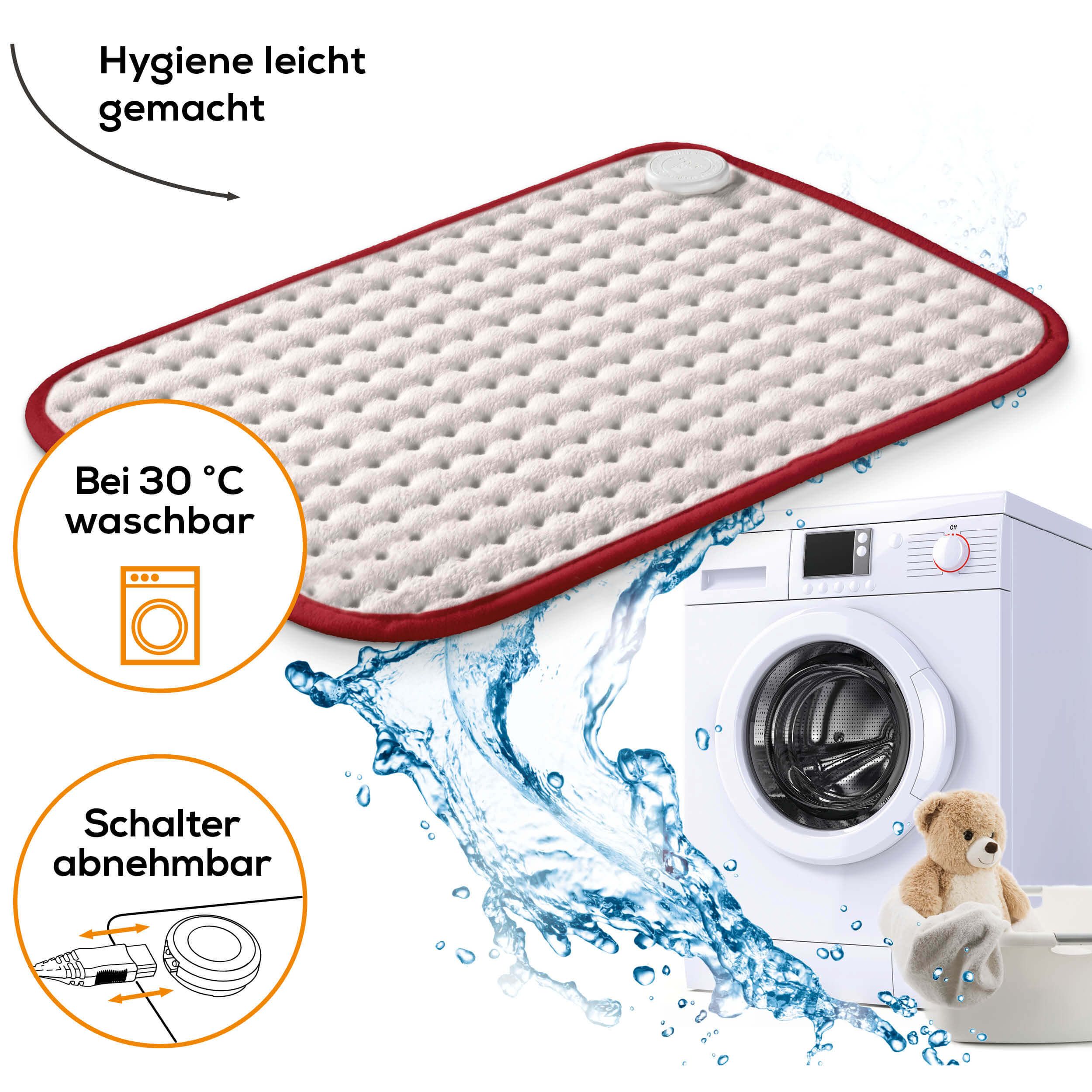 Cuscino riscaldante accanto alla lavatrice. Lavabile a 30°C. Interruttore rimovibile. Orsacchiotto.