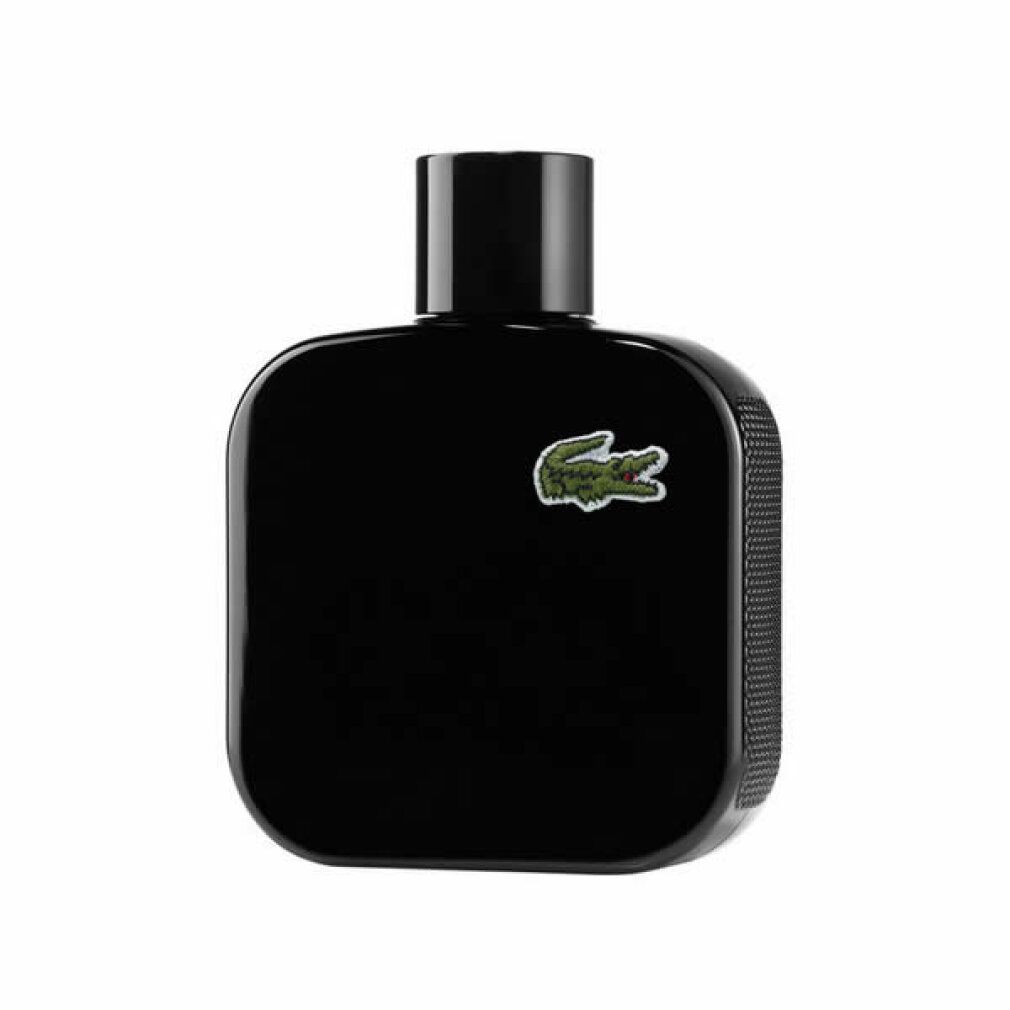 Flacone nero con tappo nero. Logo Lacoste con coccodrillo verde. Forma quadrata.