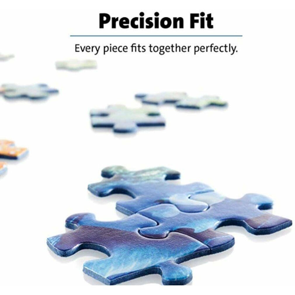 Pezi di puzzle, blu-bianco marmorizzato, su sfondo bianco. Testo: Precision Fit. Ogni pezzo si incastra perfettamente.
