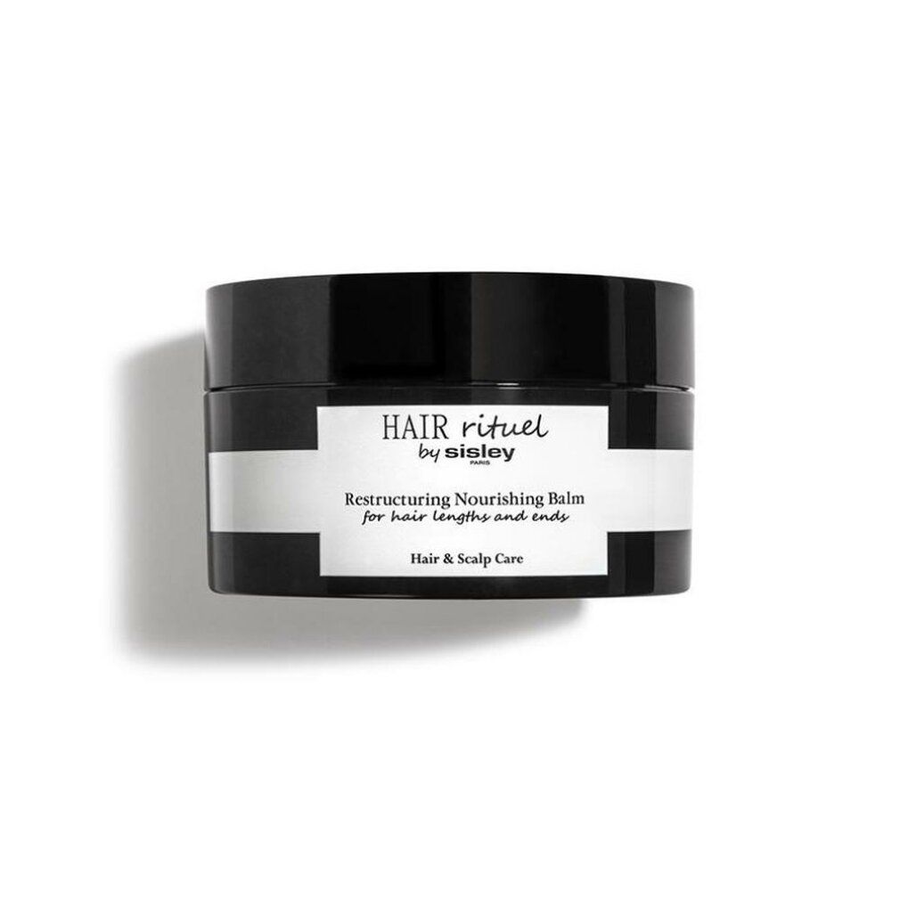 Vaso nero con etichetta bianca. Scritta: HAIR rituel by sisley. Restructuring Nourishing Balm for hair lengths and ends. Hair & Scalp Care.