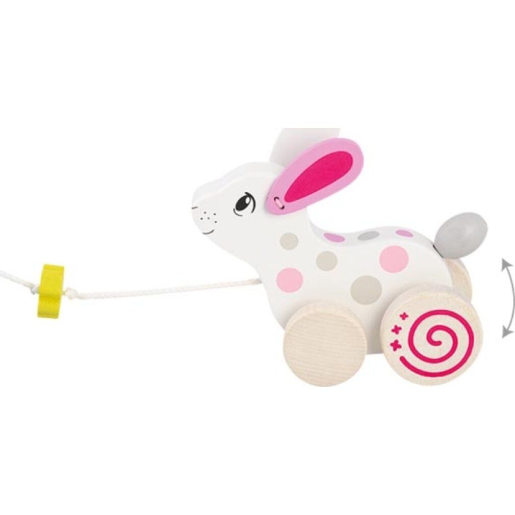 Coniglio di legno con ruote e corda. Bianco con pois rosa e grigi. Trifoglio sulla corda. Ruote con motivo a spirale.