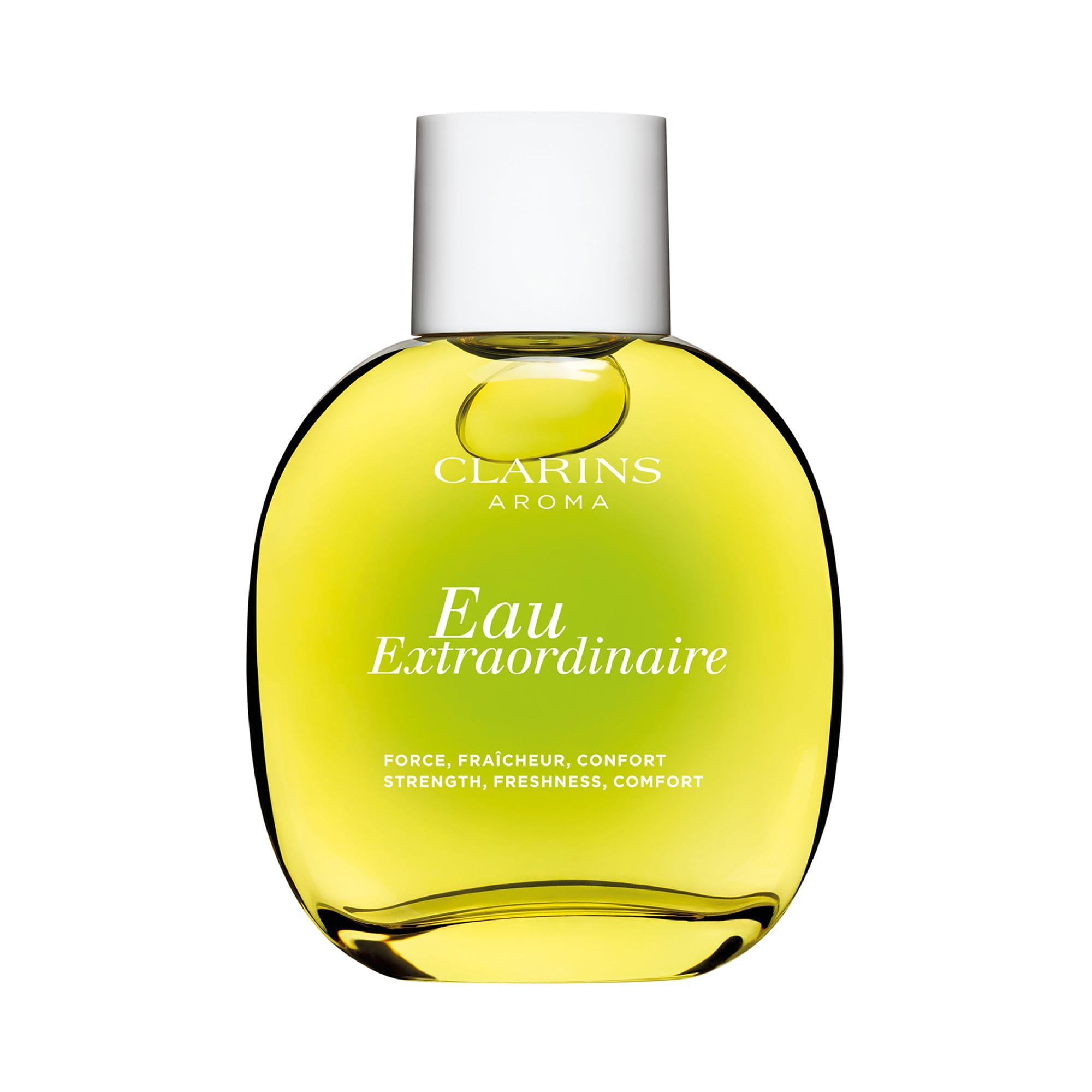 Flacone rotondo con liquido giallo. Tappo bianco. Scritta: Eau Extraordinaire, Clarins Aroma.
