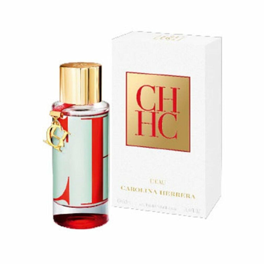 Flacone di profumo e confezione. Flacone con tappo dorato e decorazione rossa. Confezione con logo CH HC.