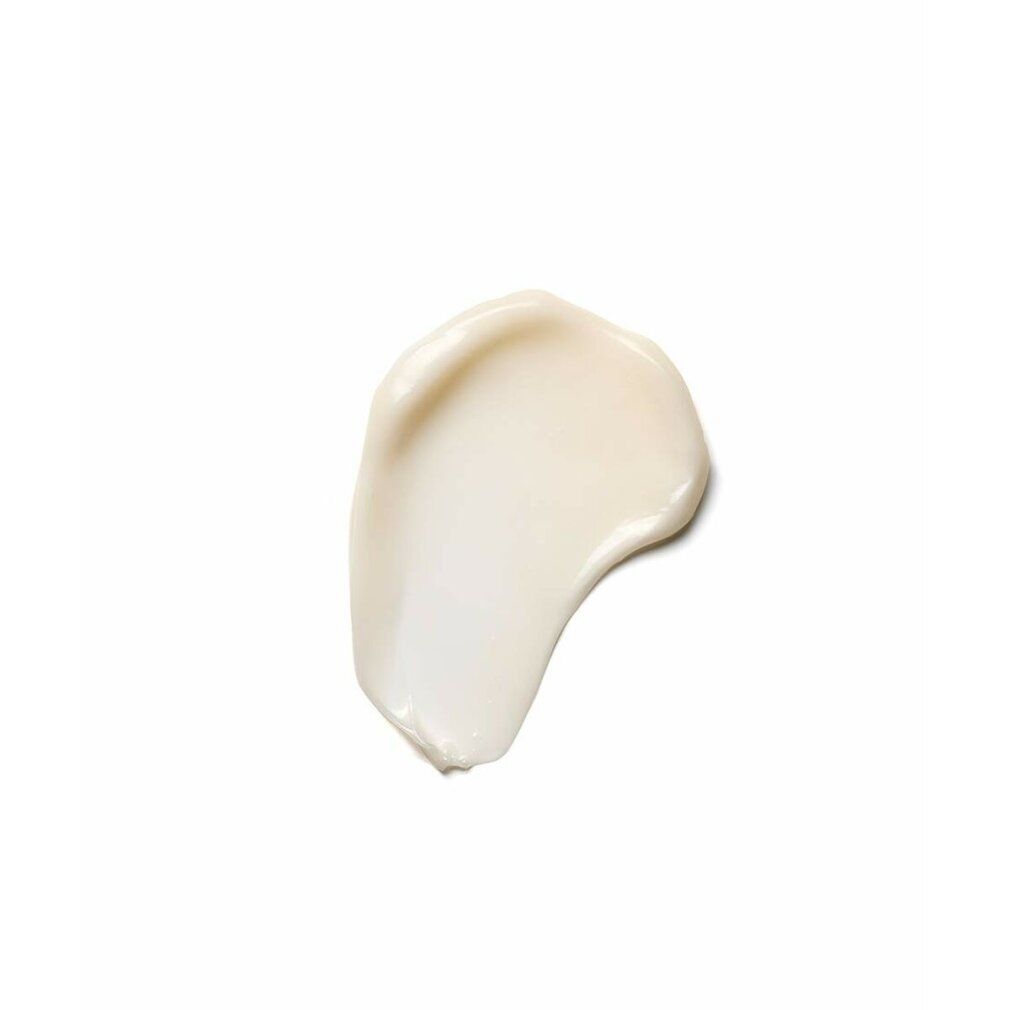 Macchia di lozione cremosa bianca su sfondo bianco.